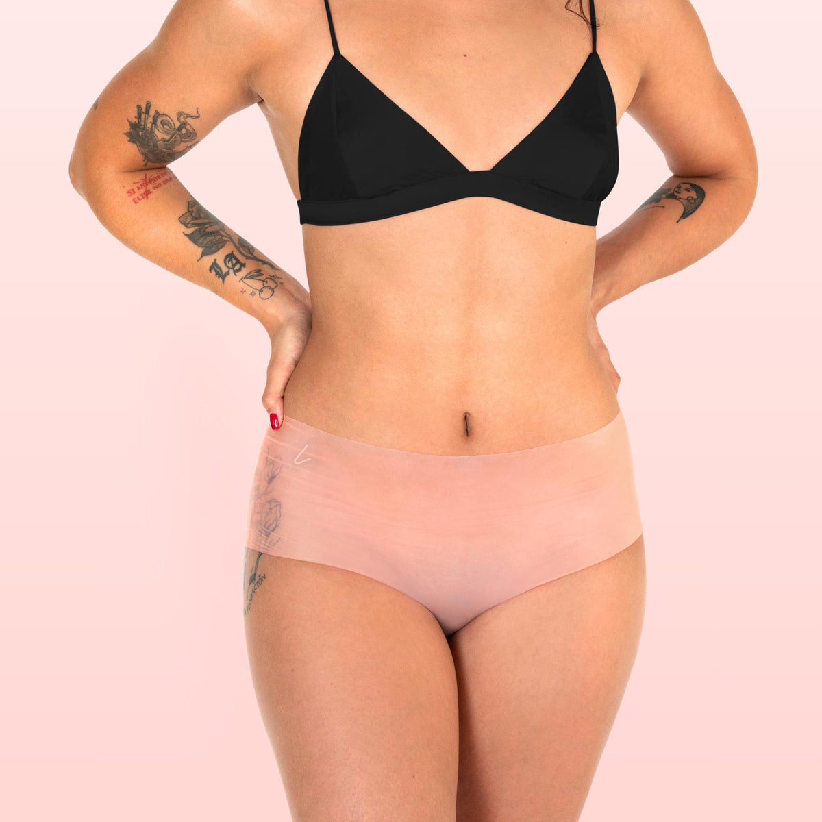 Lorals model Ahyoka demonstrates the front view of Pleasure Shortie Panties in Sheer