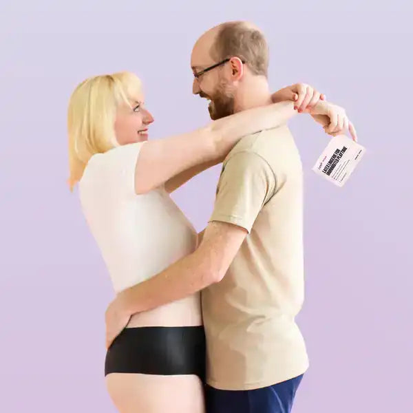 Mixed-gender couple embracing in Lorals latex underwear — offering hands-free STI protection during oral intimacy without interrupting connection