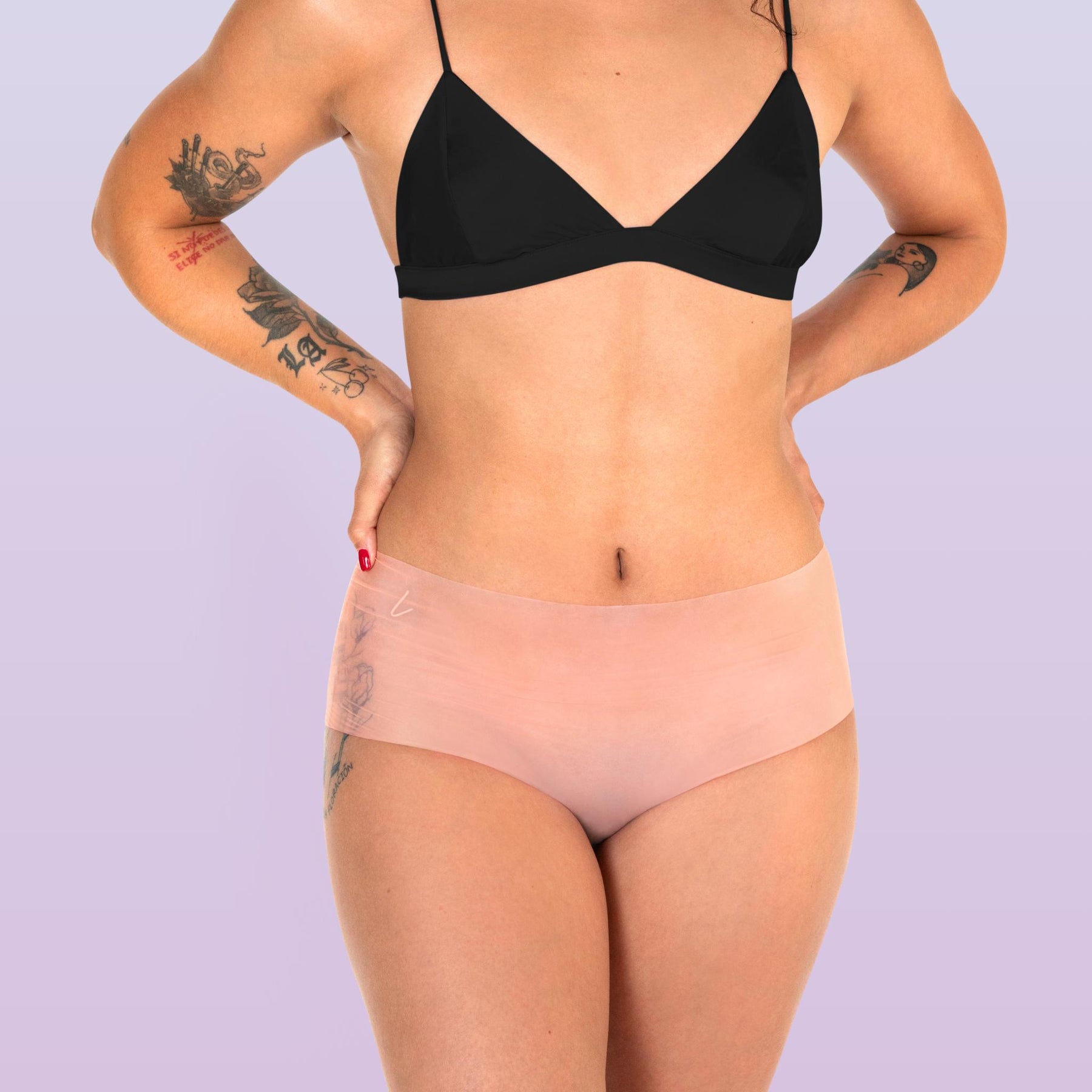 Lorals model Ahyoka demonstrates the front view of STI Protection Shortie Panties in Sheer