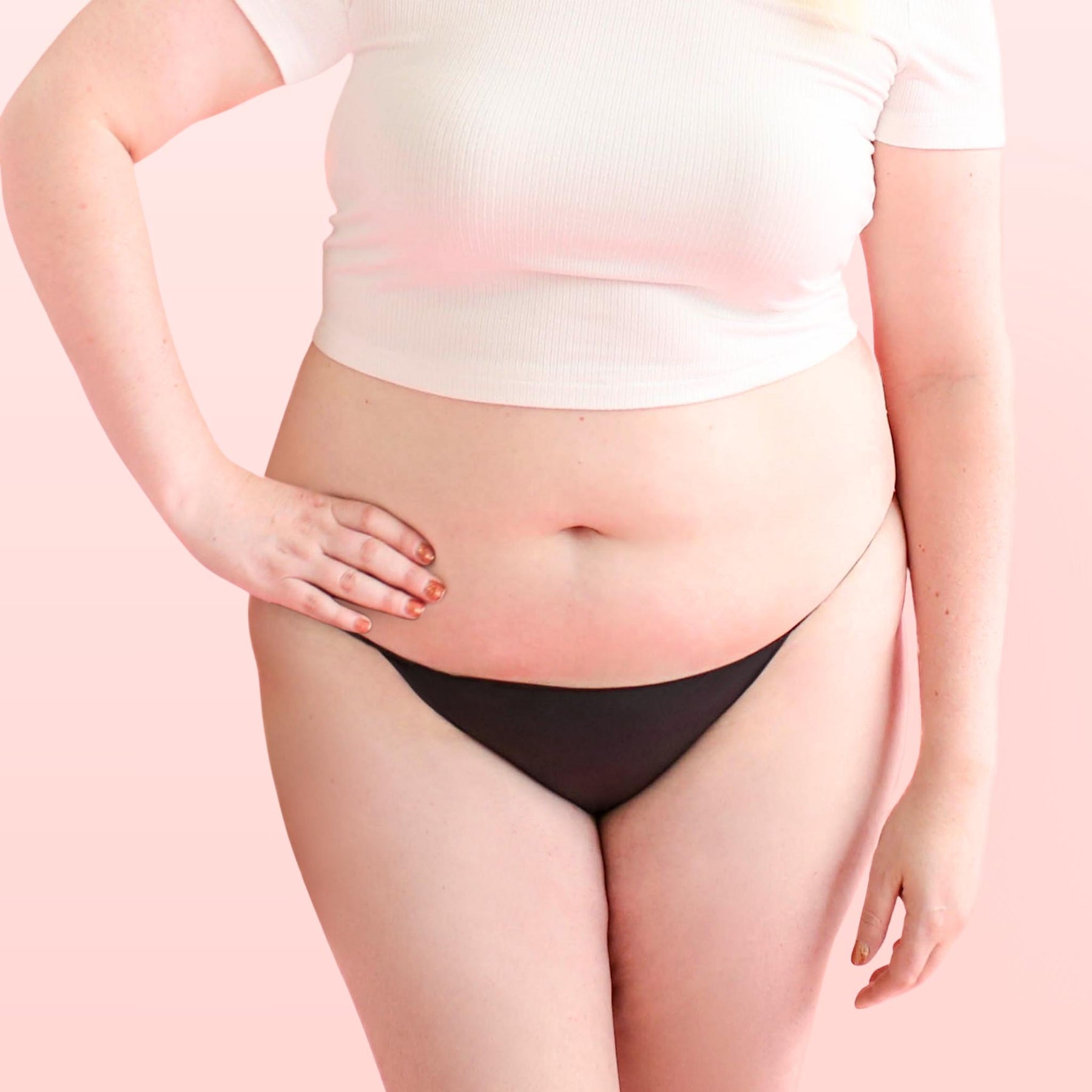 The front side of a woman who is wearing Lorals panties and a white t-shirt |Shortie