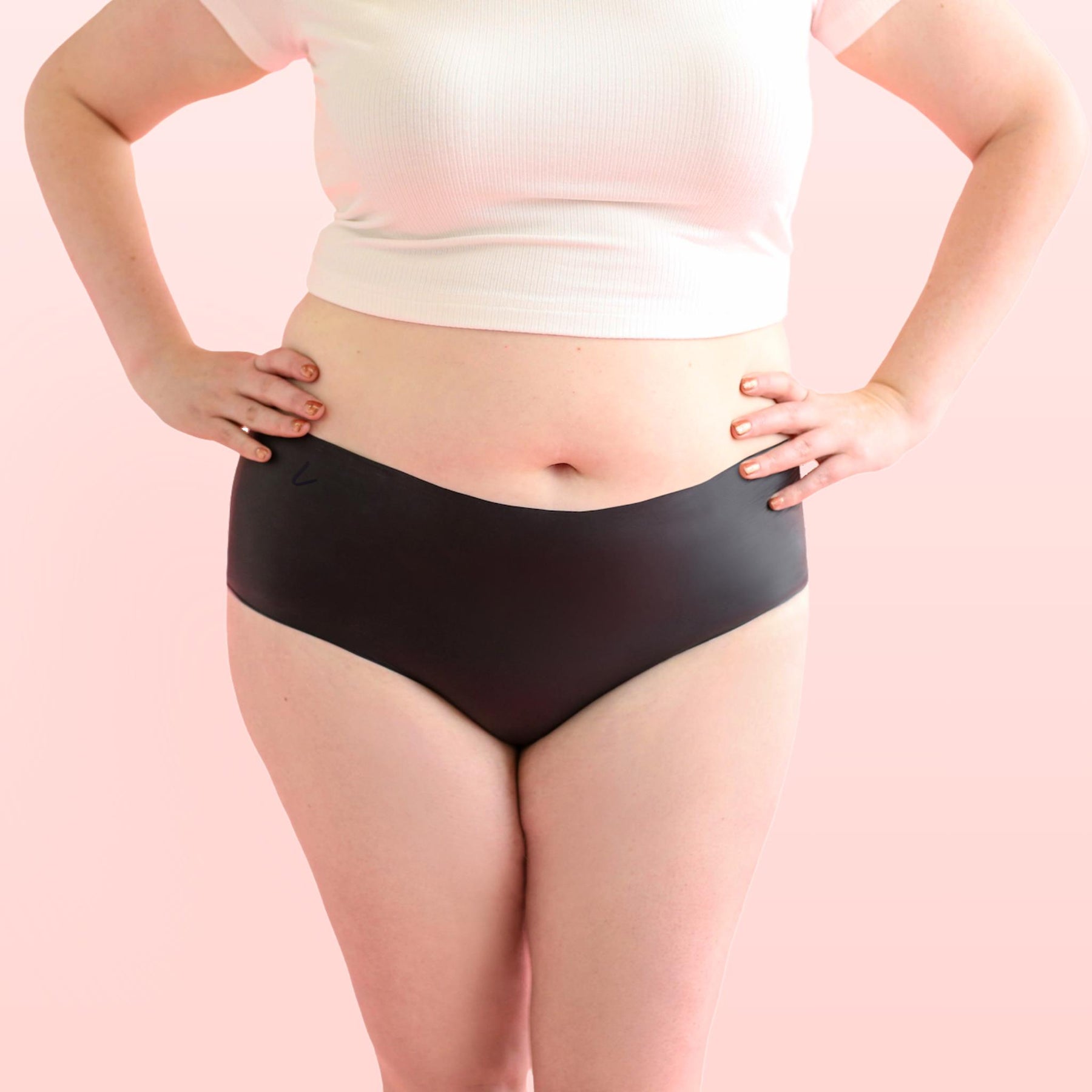 The front side of a woman who is wearing Lorals for Pleasure panties and a white t-shirt |Shortie