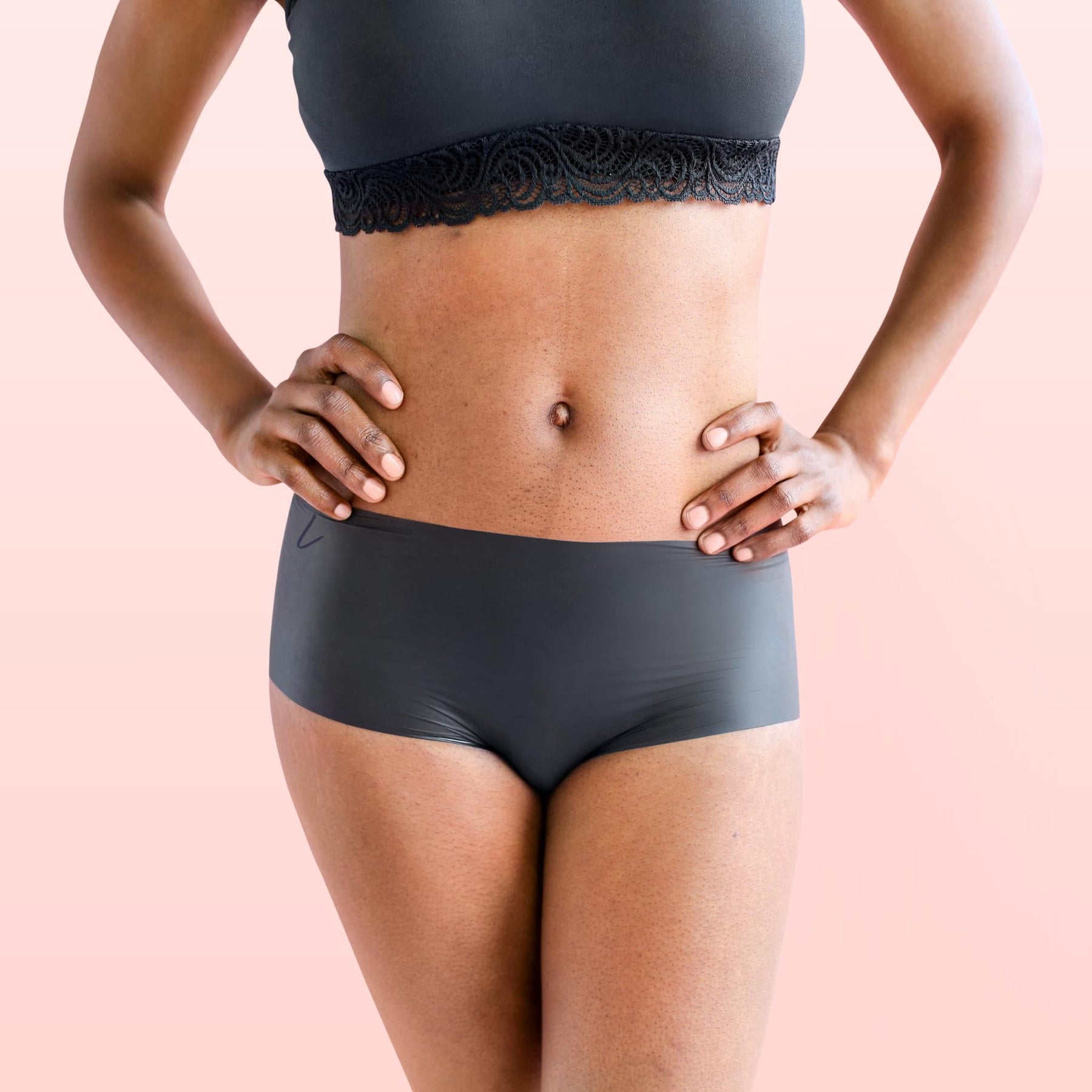 The front side of a woman wearing Lorals Latex Shorties |Shortie