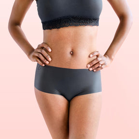 The front side of a woman wearing Lorals Latex Shorties |Shortie