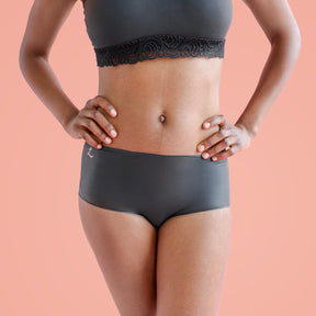 Woman posing in black latex panty and black bra|Shortie