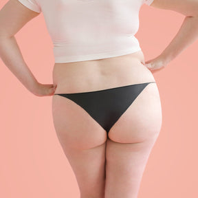 The backside of a woman wearing Lorals Latex Bikini panties |Bikini