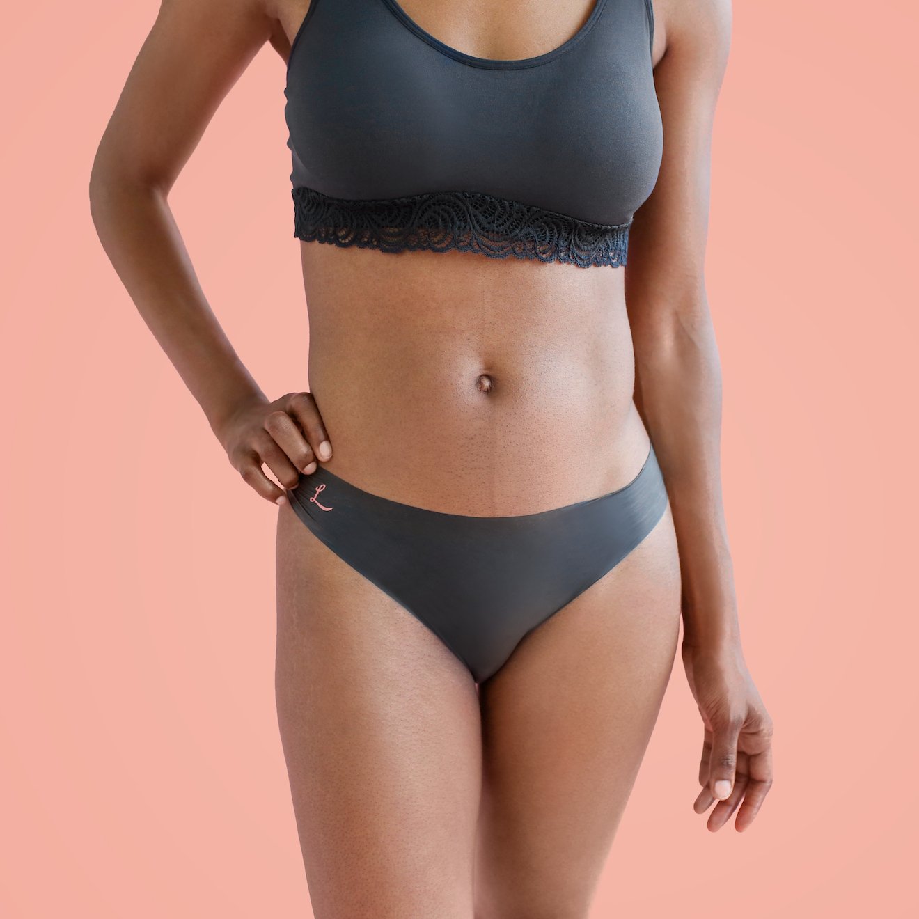 The front side of a woman wearing Lorals Latex Bikini panties |Bikini